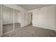 Spacious bedroom with ample natural light and a large mirrored closet at 3318 N Decatur Blvd # 2129, Las Vegas, NV 89130