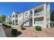 A well-maintained apartment complex featuring lush landscaping and convenient outdoor staircases at 3318 N Decatur Blvd # 2129, Las Vegas, NV 89130