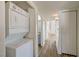 Hallway with laundry closet featuring stacked washer and dryer and view into the bathroom at 3318 N Decatur Blvd # 2129, Las Vegas, NV 89130