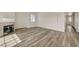Open concept living area featuring wood floors and a fireplace at 3318 N Decatur Blvd # 2129, Las Vegas, NV 89130