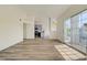 Spacious living room featuring wood floors and natural light from sliding glass doors at 3318 N Decatur Blvd # 2129, Las Vegas, NV 89130