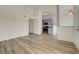 Open living room with hardwood floors and adjacent kitchen space at 3318 N Decatur Blvd # 2129, Las Vegas, NV 89130