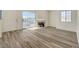 Spacious living room features a fireplace and sliding glass doors to patio at 3318 N Decatur Blvd # 2129, Las Vegas, NV 89130