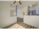 Open-concept floor plan with wood flooring connects the living room to the kitchen at 3318 N Decatur Blvd # 2129, Las Vegas, NV 89130