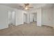 Spacious carpeted main bedroom with ceiling fan, closet with mirrors and access to the bathroom at 3318 N Decatur Blvd # 2129, Las Vegas, NV 89130