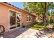 Backyard with a view of covered patio, grass and desert landscaping at 3408 Livia Ave, North Las Vegas, NV 89031