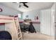 View of a cozy bedroom featuring a bunk bed and themed decor at 3408 Livia Ave, North Las Vegas, NV 89031