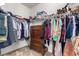 Walk-in closet with wooden drawers and racks perfect for organizing wardrobe at 3408 Livia Ave, North Las Vegas, NV 89031