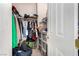 Walk-in closet with clothes and storage bins perfect for organizing wardrobe at 3408 Livia Ave, North Las Vegas, NV 89031