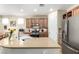 View of the open kitchen with stainless steel appliances, a center island, and a breakfast bar at 3408 Livia Ave, North Las Vegas, NV 89031