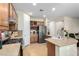 Well-equipped kitchen with stainless steel appliances, wood cabinets, and neutral countertops at 3408 Livia Ave, North Las Vegas, NV 89031