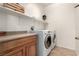 Laundry room featuring new washer and dryer with storage area at 3408 Livia Ave, North Las Vegas, NV 89031