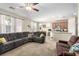 Open concept living area with comfortable sofas and view of the kitchen at 3408 Livia Ave, North Las Vegas, NV 89031