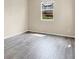 Bright bedroom features wood floors and a large window overlooking the neighborhood at 3638 Via Messina, Henderson, NV 89052