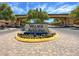 Beautifully landscaped entrance to Village of Avellino with decorative brickwork and signage at 3638 Via Messina, Henderson, NV 89052
