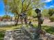 Charming bronze statue in community park with a pool in the background on a clear day at 3638 Via Messina, Henderson, NV 89052