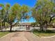Attractive community pool area with mature trees, lounge chairs, and well-maintained landscaping at 3638 Via Messina, Henderson, NV 89052