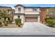 Inviting two-story home with a well-maintained front yard and attached two-car garage at 3638 Via Messina, Henderson, NV 89052
