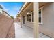 Covered patio space with neutral colors, perfect for outdoor entertaining or relaxing at 3638 Via Messina, Henderson, NV 89052