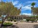 Picturesque community pool area with a flag pole, trees and lounge area at 3638 Via Messina, Henderson, NV 89052