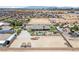 Expansive property with a single-story home, pool, additional structures, and ample land in a desert community at 3955 W Jo Rae Ave, Las Vegas, NV 89141