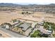 High aerial view showing a desert home, pool, and surrounding desert landscape at 3955 W Jo Rae Ave, Las Vegas, NV 89141