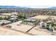 Wide aerial view showcasing a desert home's extensive yard and neighboring properties at 3955 W Jo Rae Ave, Las Vegas, NV 89141