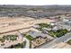 Wide aerial view of a desert home, pool, and vast desert surroundings at 3955 W Jo Rae Ave, Las Vegas, NV 89141