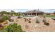 Well-maintained backyard with a pool, desert landscaping, and unique metal art installations at 3955 W Jo Rae Ave, Las Vegas, NV 89141