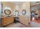 Bathroom features double sinks, makeup vanity, and a view out to the living room at 3955 W Jo Rae Ave, Las Vegas, NV 89141