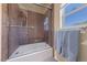 This bathroom features a tile shower and tub, as well as a bright window at 3955 W Jo Rae Ave, Las Vegas, NV 89141