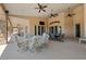 Spacious covered patio with multiple ceiling fans and dining areas for luxurious outdoor living at 3955 W Jo Rae Ave, Las Vegas, NV 89141