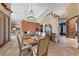 Bright dining room featuring large windows, a wooden table, comfortable seating, and elegant décor for dinner gatherings at 3955 W Jo Rae Ave, Las Vegas, NV 89141