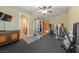 Spacious home gym with hardwood and rubber flooring, and a view of the bathroom at 3955 W Jo Rae Ave, Las Vegas, NV 89141