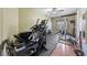 A well-equipped home gym featuring an elliptical machine and weightlifting equipment at 3955 W Jo Rae Ave, Las Vegas, NV 89141