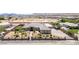Stunning front view of a desert home with a secure gated entrance and desert landscaping at 3955 W Jo Rae Ave, Las Vegas, NV 89141