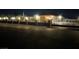 Well-lit, fenced home at night, boasting both security and curb appeal at 3955 W Jo Rae Ave, Las Vegas, NV 89141