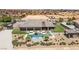 Backyard view of luxury estate with a pool and outdoor kitchen at 3955 W Jo Rae Ave, Las Vegas, NV 89141