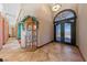Inviting foyer with tile flooring, a decorative front door, and a classic grandfather clock at 3955 W Jo Rae Ave, Las Vegas, NV 89141