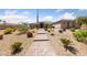 Exterior of desert home with beautiful desert landscaping and an American flag at 3955 W Jo Rae Ave, Las Vegas, NV 89141