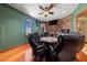 Game room with a poker table, hardwood floors, stone accent wall, and scenic view at 3955 W Jo Rae Ave, Las Vegas, NV 89141