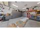 Garage view includes custom storage cabinetry, organizational tools, and ample lighting at 3955 W Jo Rae Ave, Las Vegas, NV 89141