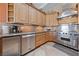 Modern kitchen featuring stainless steel appliances, granite countertops, and custom cabinetry at 3955 W Jo Rae Ave, Las Vegas, NV 89141