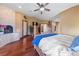 A well-lit main bedroom featuring a cozy fireplace and hardwood floors at 3955 W Jo Rae Ave, Las Vegas, NV 89141