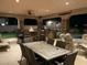 Expansive outdoor patio with stone accents, a fireplace, and ample seating at 3955 W Jo Rae Ave, Las Vegas, NV 89141