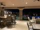 Well-appointed outdoor patio featuring a fire pit, bar seating and views at 3955 W Jo Rae Ave, Las Vegas, NV 89141
