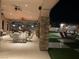 Spacious covered patio with stone pillars and multiple seating areas at 3955 W Jo Rae Ave, Las Vegas, NV 89141