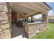 Covered outdoor patio with an outdoor built in BBQ and bar area at 3955 W Jo Rae Ave, Las Vegas, NV 89141