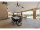Large covered patio with dining and seating areas, perfect for entertaining at 3955 W Jo Rae Ave, Las Vegas, NV 89141