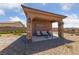 Comfortable covered outdoor seating area with stone pillars, perfect for enjoying the fresh air at 3955 W Jo Rae Ave, Las Vegas, NV 89141